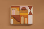 Top view of the Raduga Grez Apartment building blocks organized in it's wooden tray with a brown/tanned background