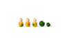 The image shows four wooden figurines with natural wood heads and yellow bodies accented in green, and two green wooden balls of different sizes. The objects are arranged in a straight line, with the figurines on the left and the balls on the right. The toys are simple yet colorful, designed for educational or play purposes.
