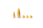 The image shows five wooden objects arranged in a row. From left to right, there are two cone-shaped figures with small black dots resembling eyes, followed by three spherical objects. The cone-shaped figures have a gradient color from natural wood at the bottom to yellow at the top, with the larger cone featuring a floral design. The spherical objects are uniformly yellow.