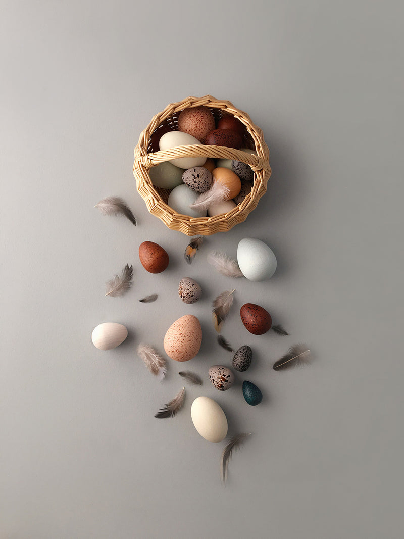Wooden eggs in a rattan basket by Erzi x  Moon Picnic
