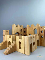 Woodberry Bauspiel Castle blocks set up to form a castle, including castle gates, stairs and towers. 