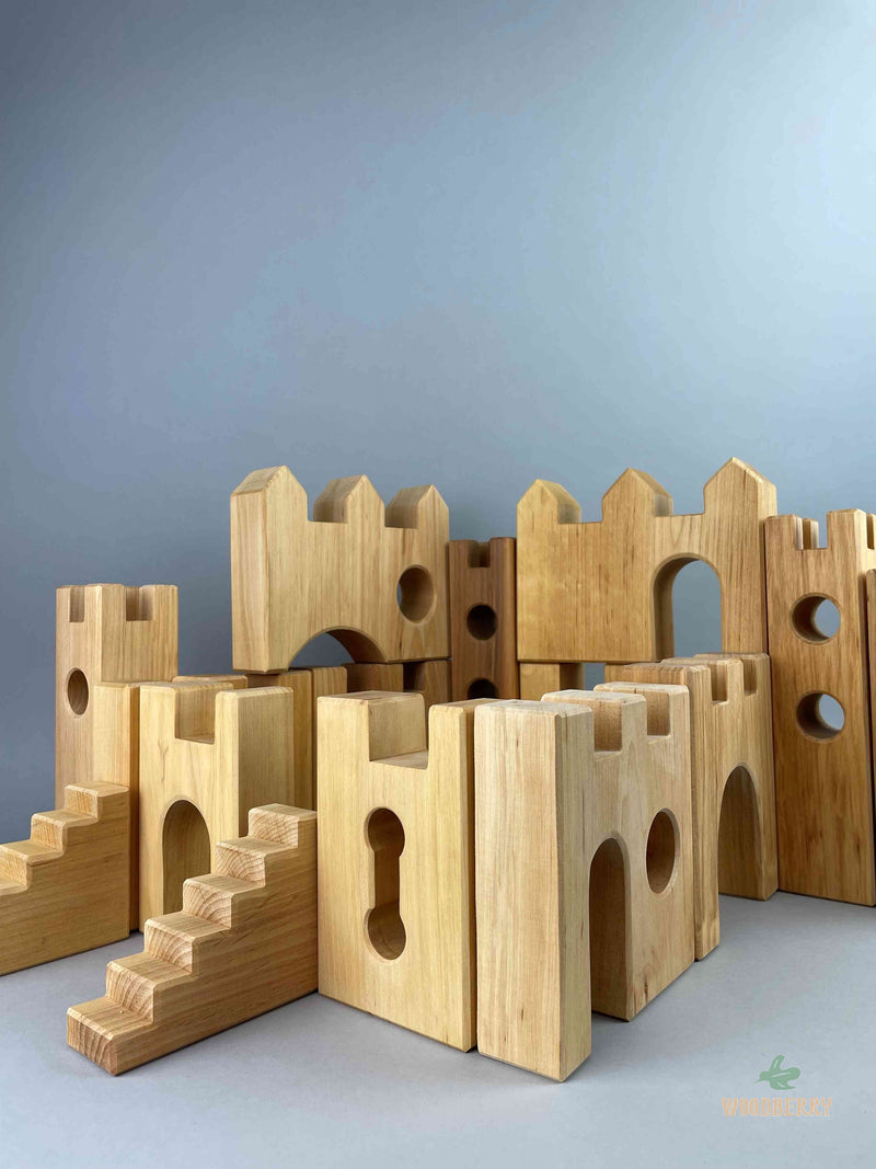Woodberry Bauspiel Castle blocks set up to form a castle, including castle gates, stairs and towers. 
