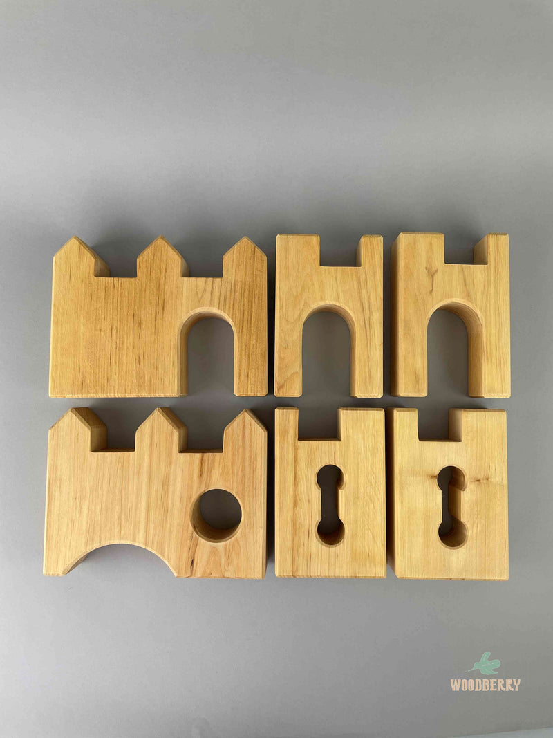Woodberry Bauspiel six piece castle set showing each of the six pieces laying flat. 