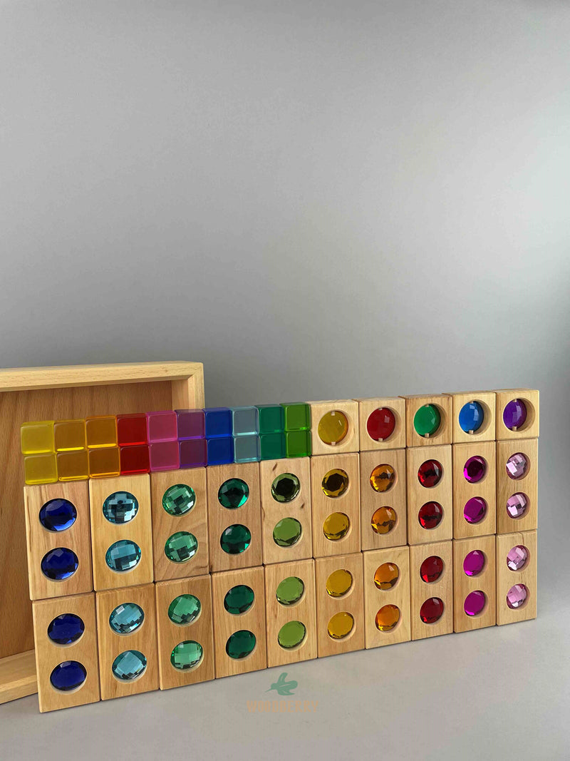Full image of Bauspiel combination set standing upright. Includes 20 wooden colour street blocks, 20 acrylic lucent cubes, 5 gemmed window blocks and tray. 