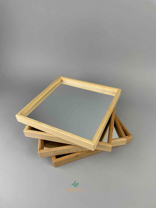 Woodberry Bauspiel set of 4 Mirror Trays stacked on top of each other. 