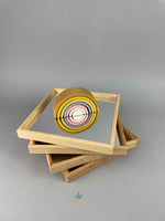 Woodberry Bauspiel Set of 4 Mirror Trays stacked with a small rainbow stacker placed on top. 