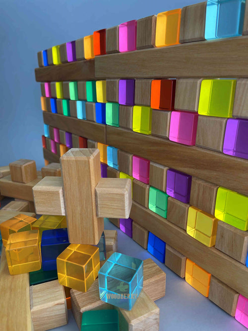 Arrangement of Plus Blocks and Lucent cubes from Bauspiel stacked upright to show compatibility. 