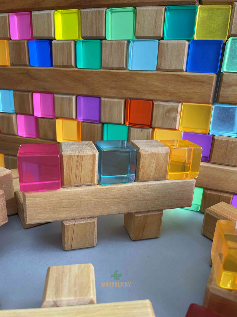 Arrangement of Plus Blocks and Lucent cubes from Bauspiel stacked upright to show compatibility. 
