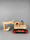Woodberry Fagus Excavator wooden toy side view angle with lowered arm and bucket. Includes two peg people. 