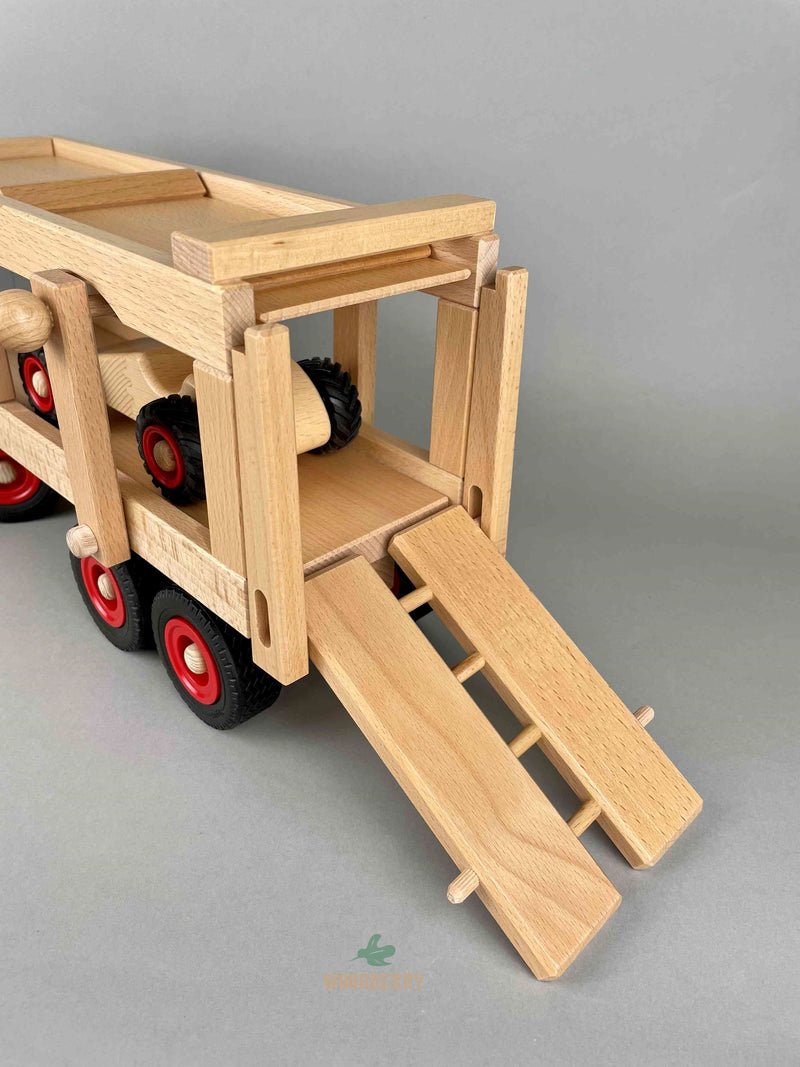Woodberry Fagus Car Transporter rear view with ramp lowered and racer car loaded in transporter bed. 