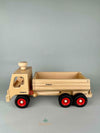 Woodberry Fagus Container Tipper Truck side view of truck with bed lowered. 