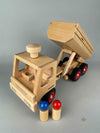 Woodberry Fagus Container Tipper Truck front angle view with raised container bed and two peg people. 