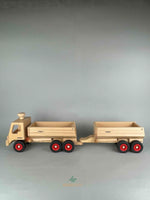 Woodberry Fagus Container Tipper truck side view image of truck with additional dump trailer attachment shown hitched on the rear. 
