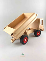 Woodberry Fagus Dump truck side/rear angle view of raised truck bed and opened tailgate. 