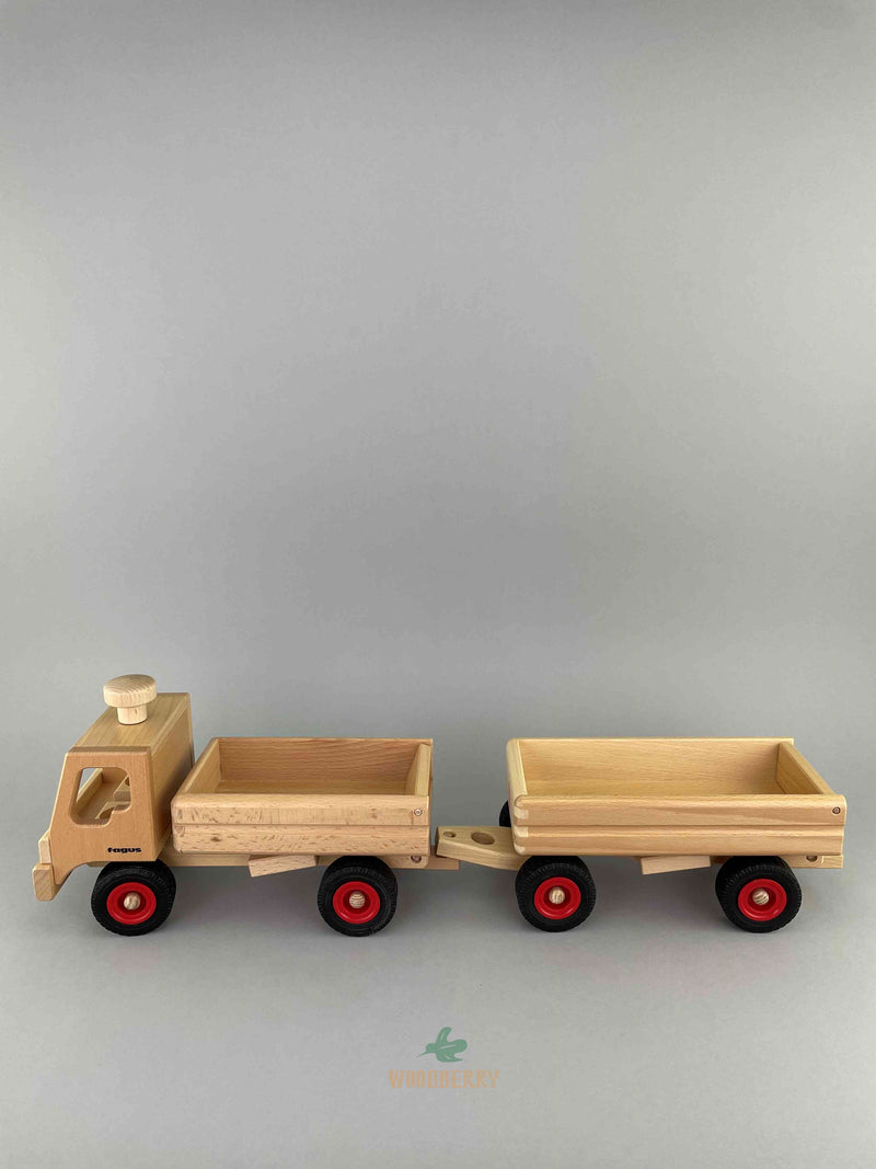 Woodberry Fagus Dump Truck Trailer side view attached to dump truck. 