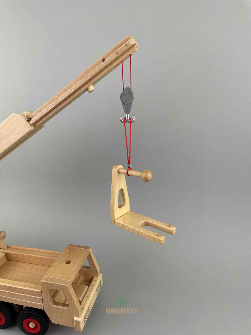 Wooden Fork attachment for the Fagus mobile crane or floor crane. The fork attachment is attached on the double hook of the extended arm of the wooden mobile crane. 
