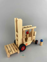 Woodberry Fagus Forklift side view with pallet and two peg people. 