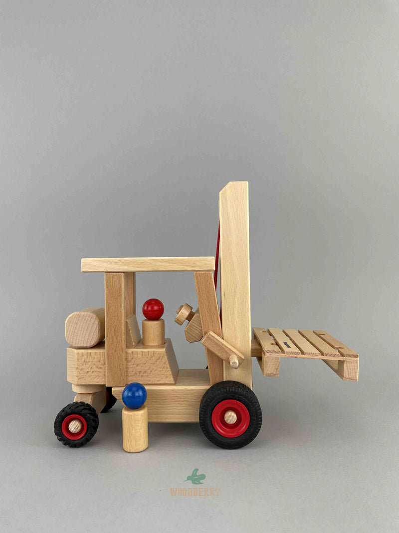 Woodberry Fagus Forklift side view with two peg people and euro pallet at lower setting. 
