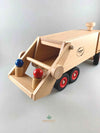 Woodberry Fagus Garbage truck wooden toy rear angle view with two peg people sitting in garbage truck loading arm. 