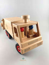 Woodberry Fagus Garbage Truck wooden toy front angle view of truck with two peg people in cab. 