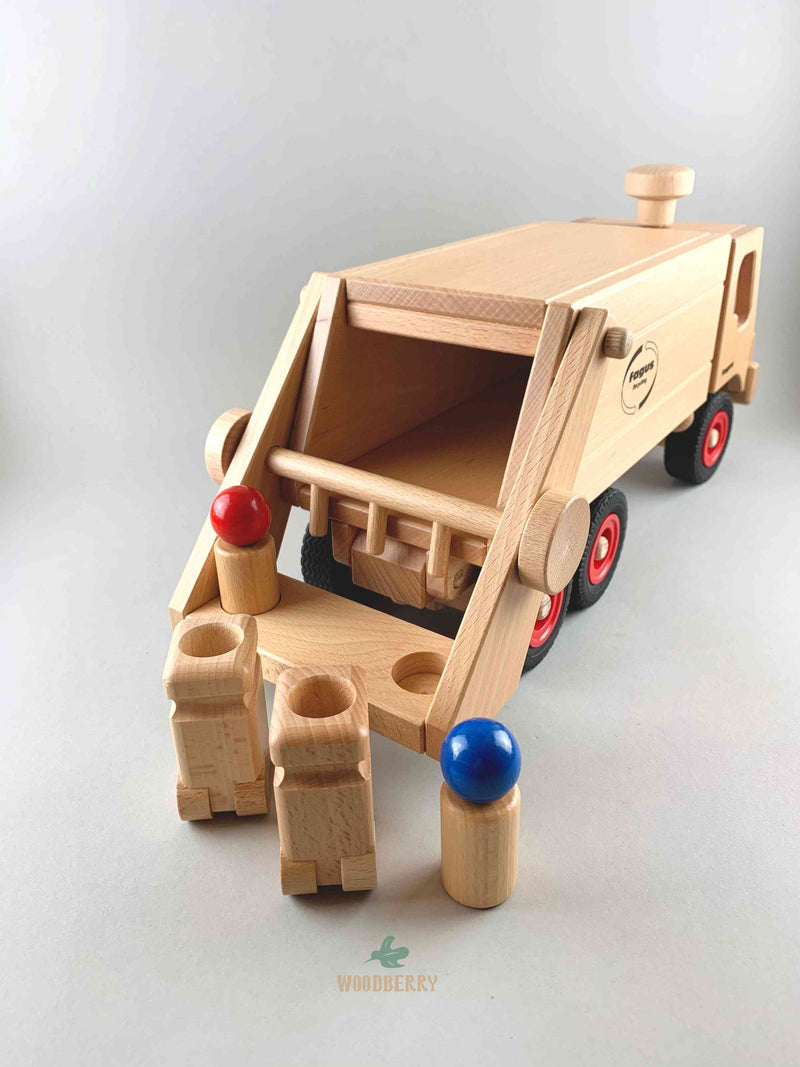 Woodberry Fagus Garbage Truck wooden toy rear view angle showing contents of truck bed. Two peg people and garbage bins sit in the foreground. 