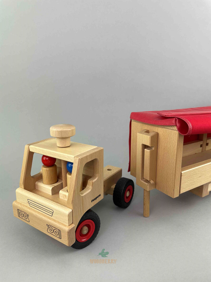 Woodberry Fagus Semi-Truck and Trailer wooden toy with Truck detached from trailer. Trailer support extended to show how trailer sits on level surface.