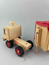 Woodberry Fagus Semi-truck and trailer wooden toy. Rear view image of detached truck and extended trailer support. 