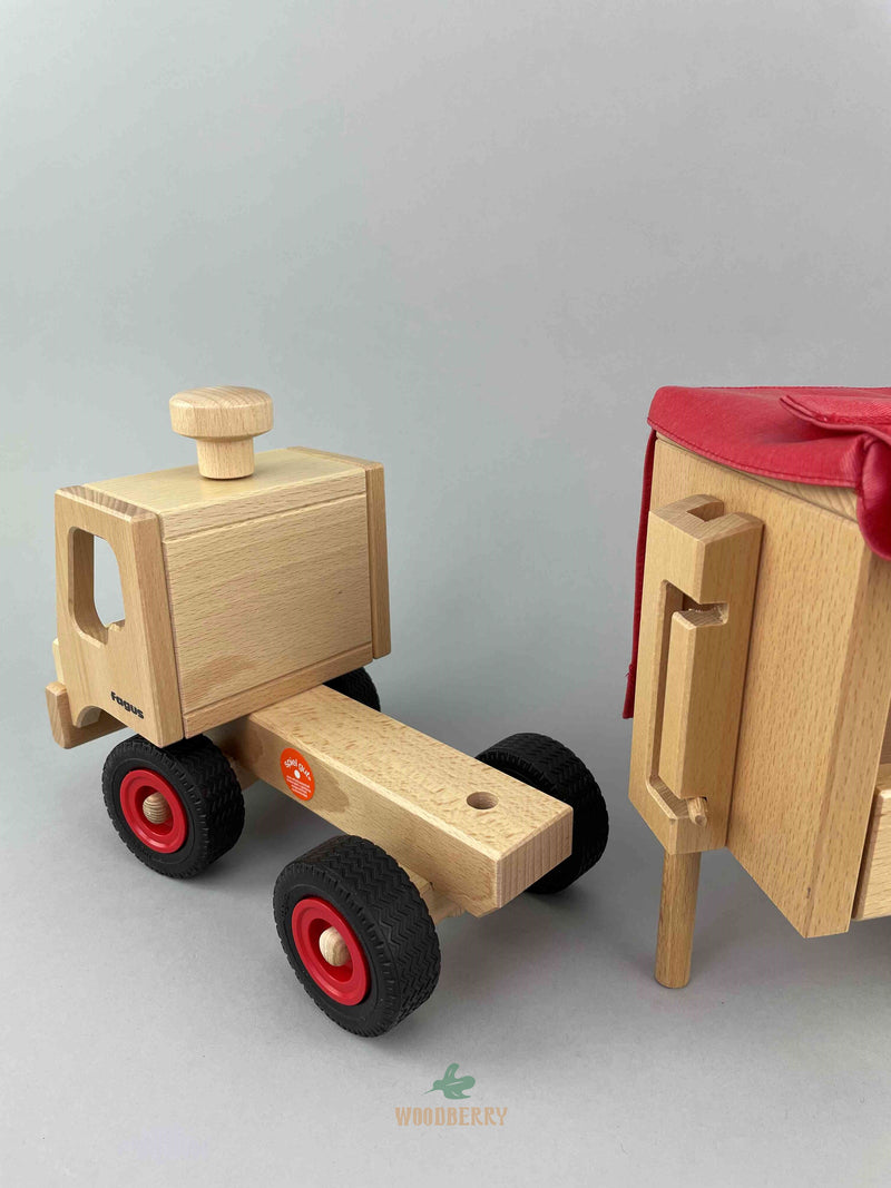 Woodberry Fagus Semi-truck and trailer wooden toy. Rear view image of detached truck and extended trailer support. 