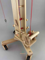 Close up of crane mechanism for standing wooden crane.  All three cranks and support handle visible. 