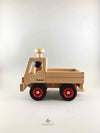 Woodberry Fagus Unimog truck side view with two peg people sitting in truck.