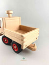 Woodberry Fagus Unimog truck rear view angle that shows truck bed and trailer hitch. 