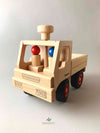 Woodberry Fagus Unimog truck front angle view of truck with two peg people sitting inside.