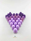 Grapat mandala purple eggs wooden toys displayed in a heart shape.