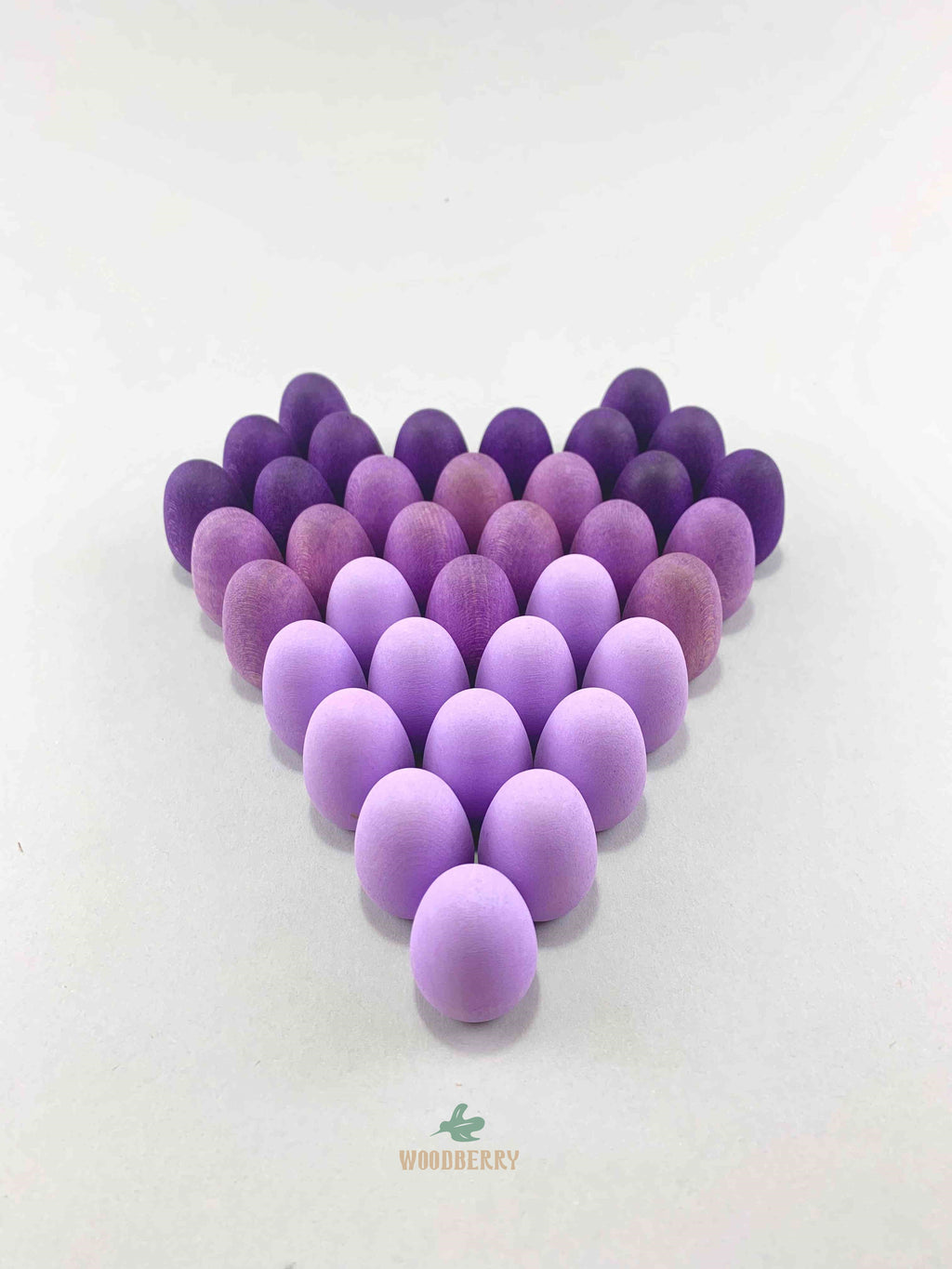 Grapat mandala purple eggs wooden toys displayed in a triangle shape.