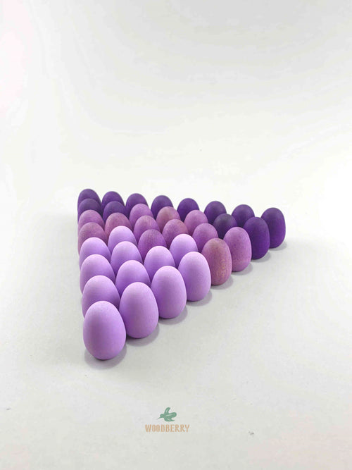 Grapat mandala purple eggs wooden toys displayed in a triangle shape.