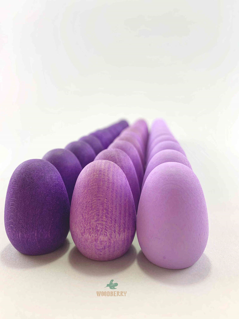 Grapat mandala purple eggs wooden toys displayed in rows..