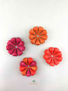 Grapat mandala red fire wooden toys displayed in four flower shapes.