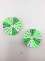 Grapat mandala green cone wooden toys displayed in two circle shapes.