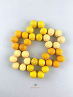 Grapat mandala yellow honeycomb wooden toys displayed in a flower shape.