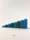 Grapat mandala blue little coin wooden toys displayed in stacks.