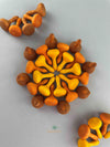 Grapat 2023 Pumpkin mandala pieces arranged in a central circular pattern.