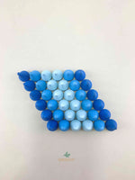 Grapat mandala blue raindrop wooden toys displayed as a parallelogram.