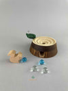 Woodberry Oak Village marble run tree stump with glass marbles and wooden squirrel figure. 